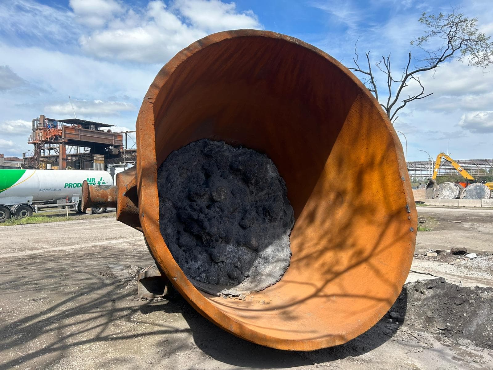 Industrial slag pot with solidified residue at steel plant yard