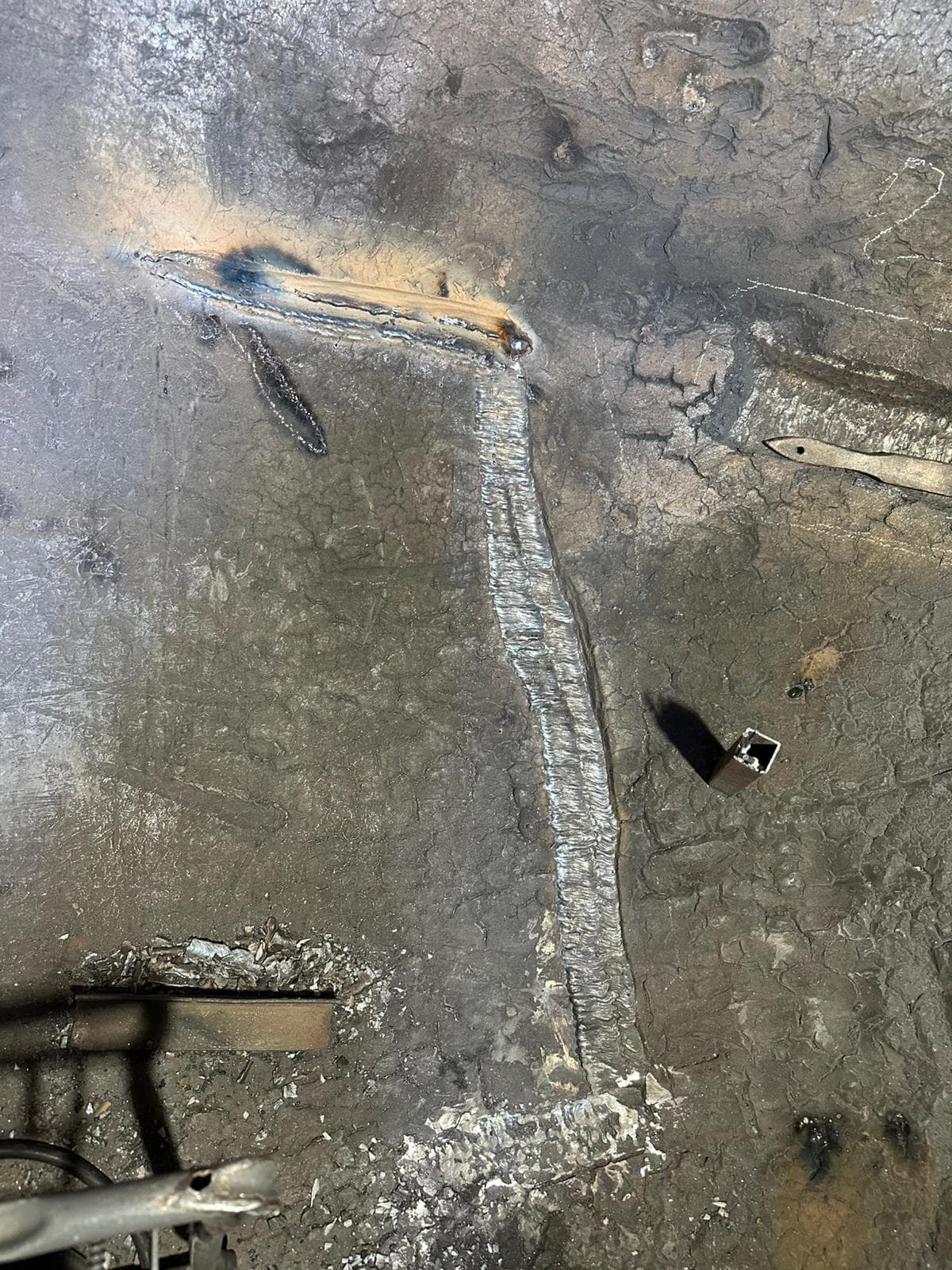 Fresh weld seam repair on industrial steel surface