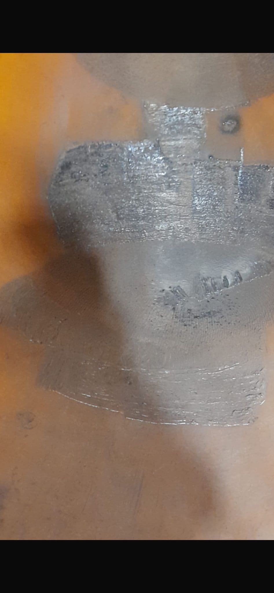Weld repair patch on steel surface inside slag pot